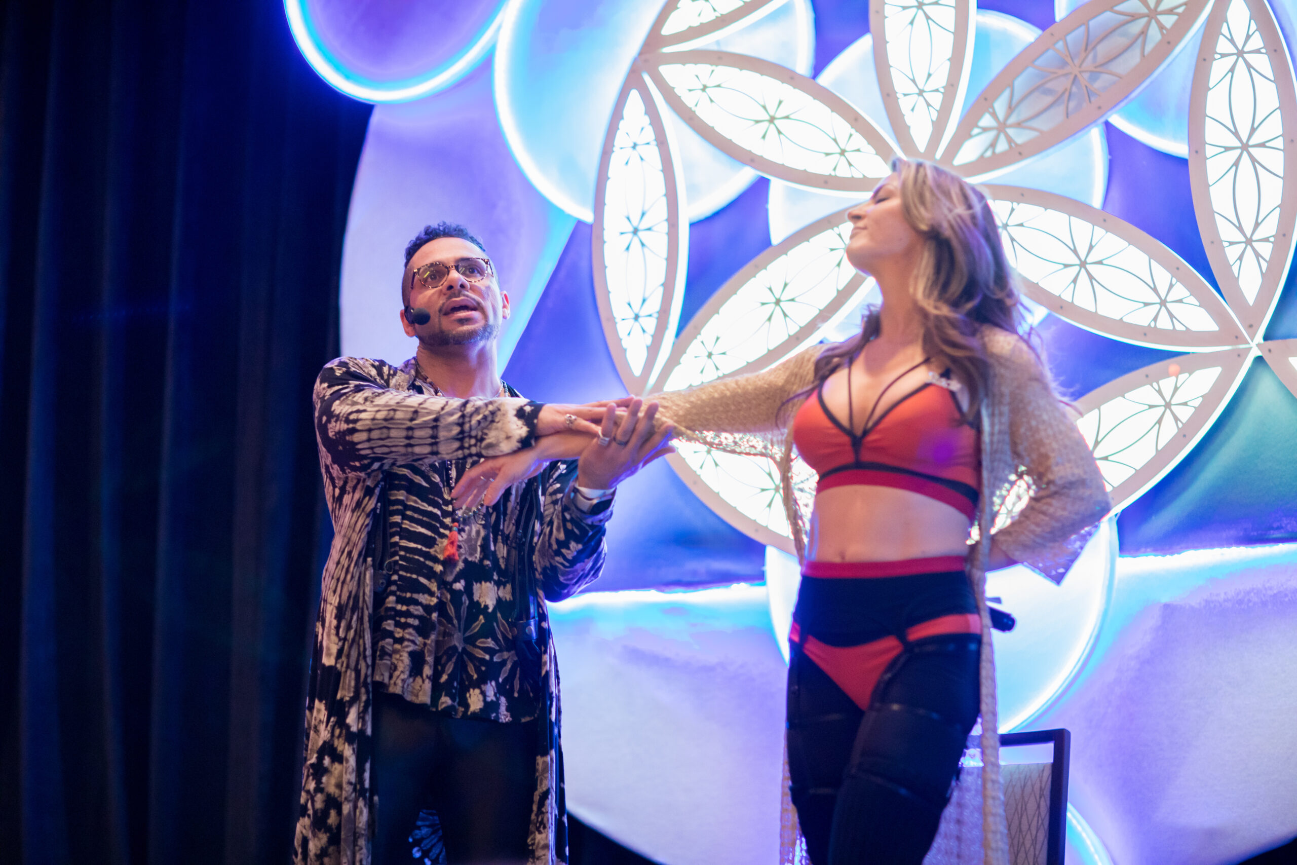 Sex coach Stacie Ysidro and Johnny Vajra on stage at interfusion 2022